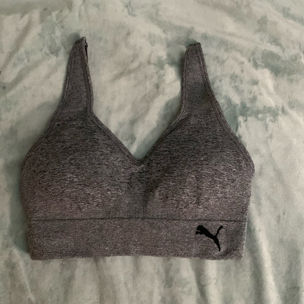 Puma women’s padded grey sports bra with adjustable straps and stretchy material